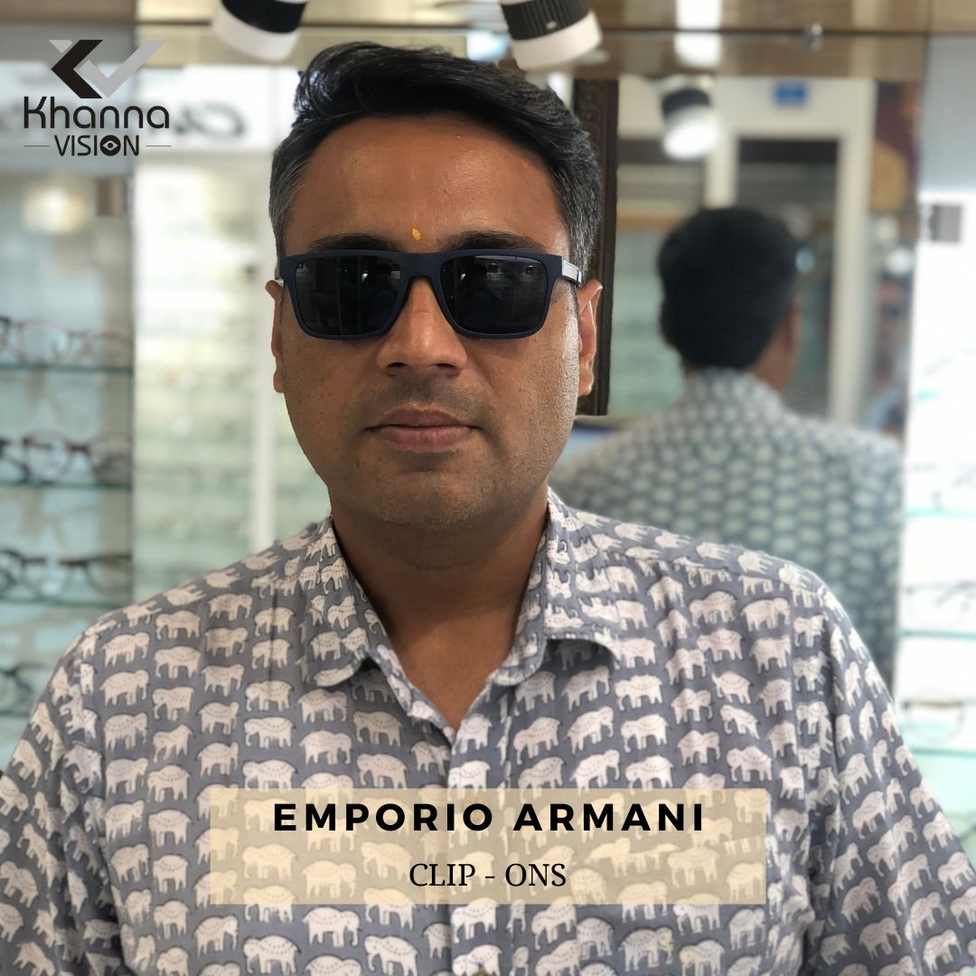 Customer wearing Emporio Armani clip-on sunglasses, navy frame